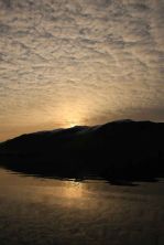 the sun  behind maiden moor derwentwater.jpg